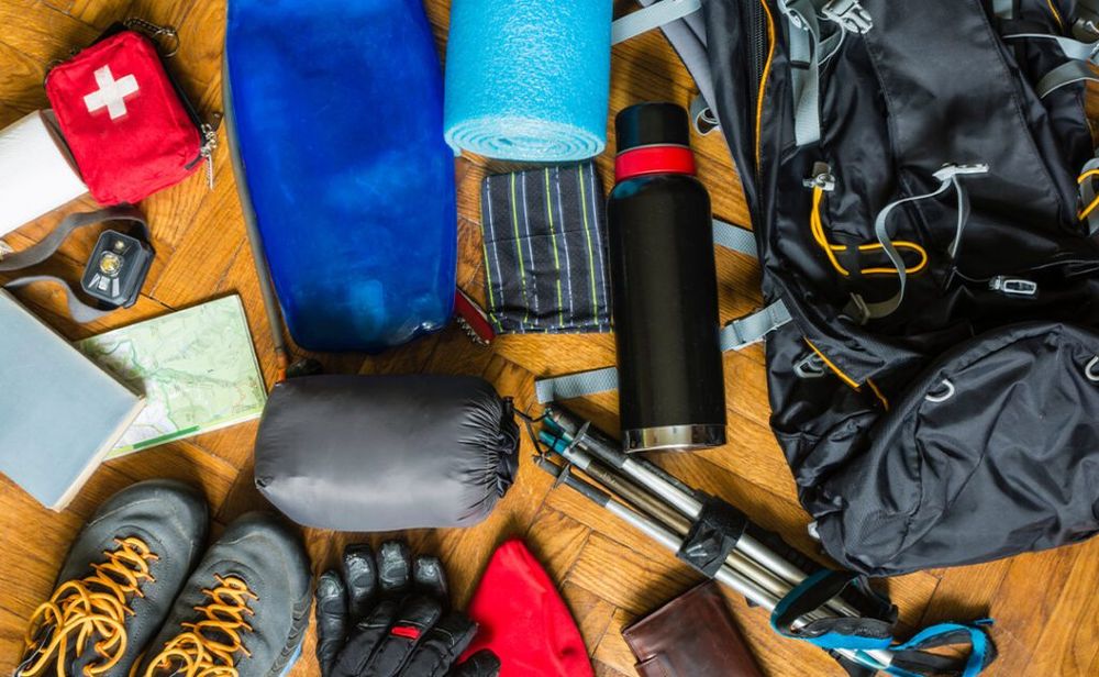 Hiking gear spread out on floor